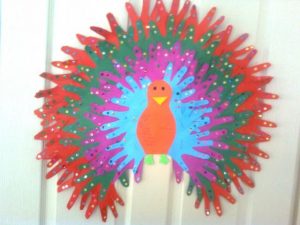 handprint peacock bulletin board idea for kids